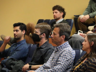 image of faculty and students sitting in a lecture hall